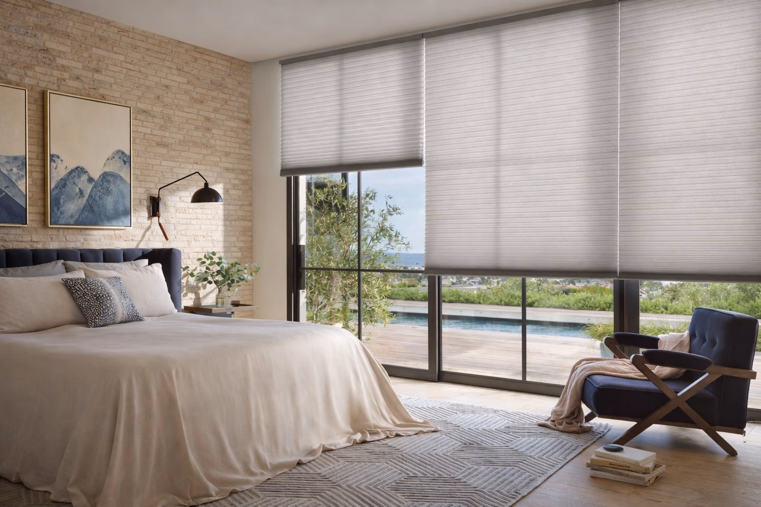 Hunter Douglas Silhouette Window Shadings on large bedroom windows providing light filtering with pool and garden views visible through sheer vanes, installed by Bay Blinds