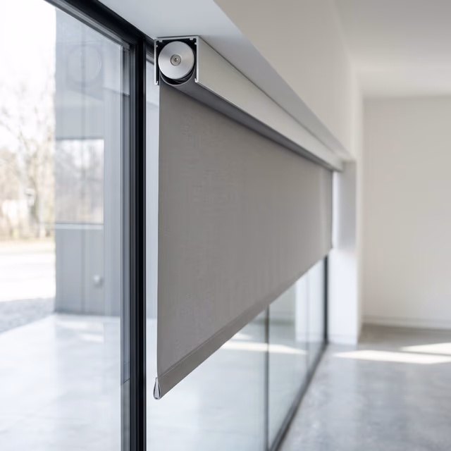 J Geiger architectural motorized shade hardware with concealed fascia and precision-machined aluminum for commercial installations